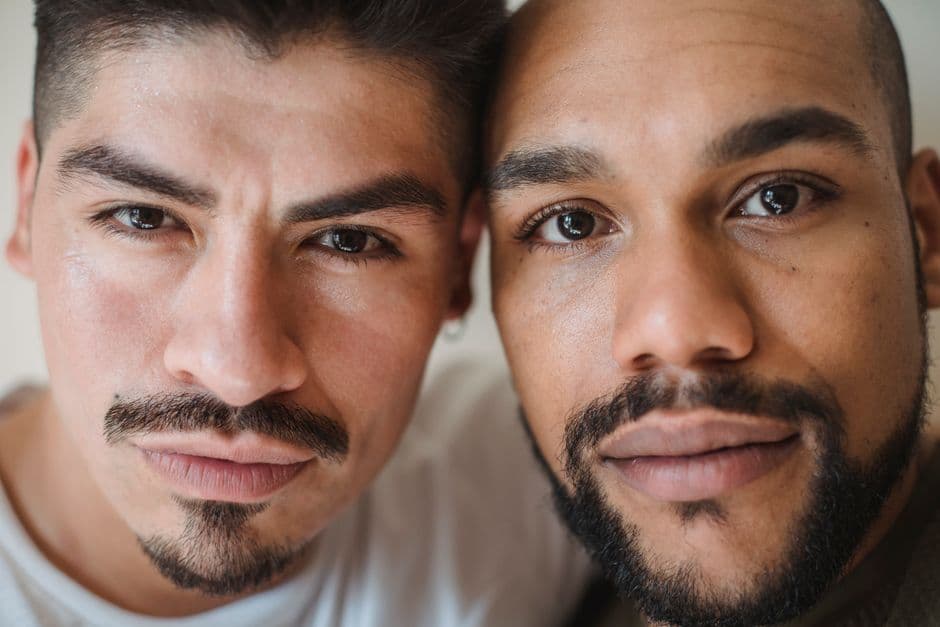Two men, one with stubble and one with a full beard