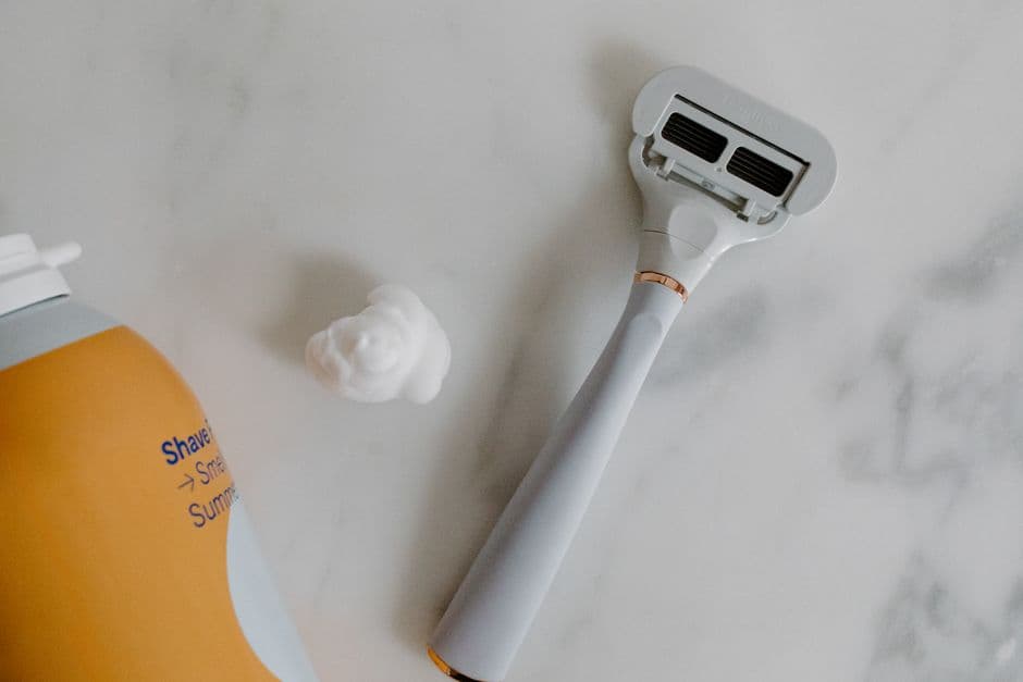 Two electric shavers side by side on a counter
