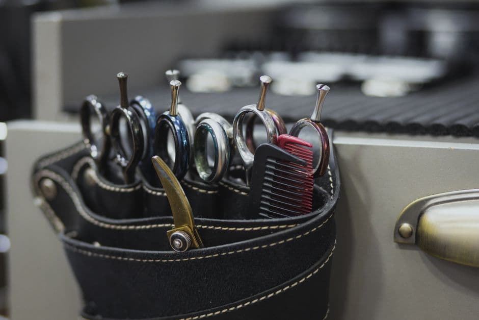Hairdressing shears and a comb on a barber's counter