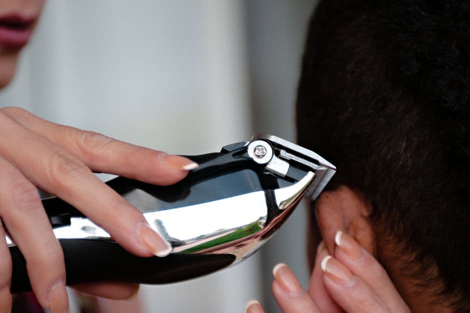 Two hair clippers side by side on a counter
