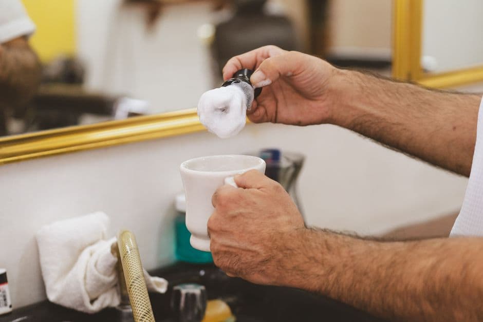 A shaving brush and lather bowl