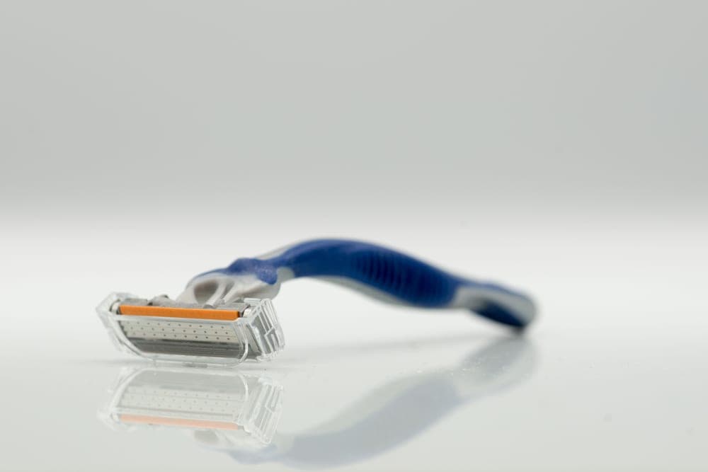 A multi-blade cartridge razor head photographed close up