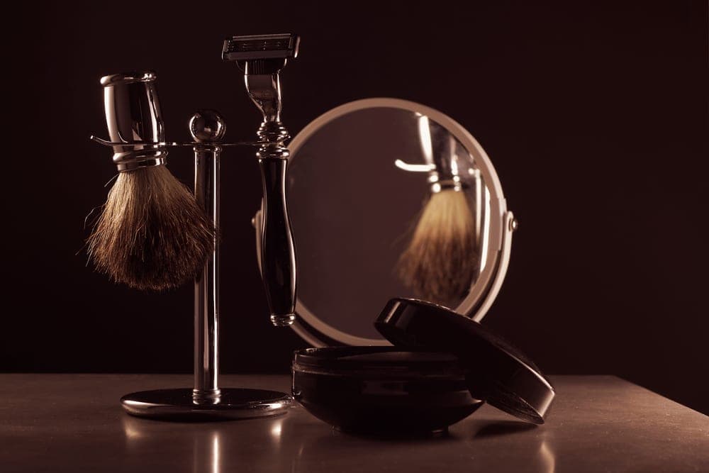 A traditional wet shaving setup arranged on a counter