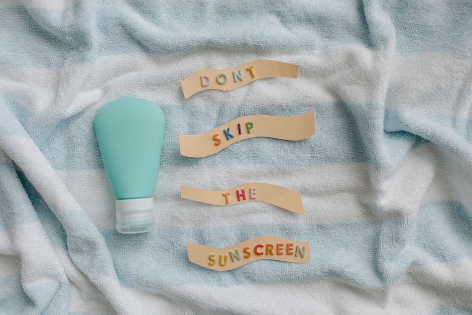 A sunscreen bottle on a towel beside a note reading do not skip the sunscreen