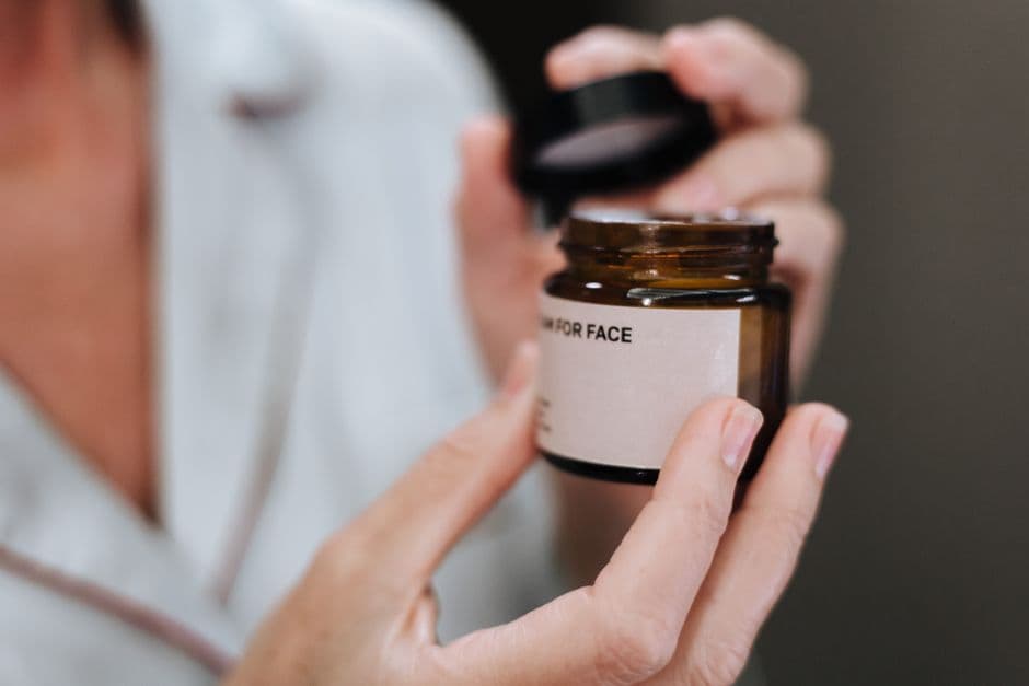 A small jar of eye cream on a surface