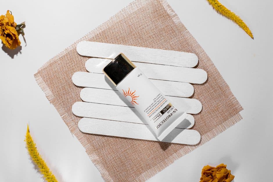 Sunscreen swatches on a plain surface
