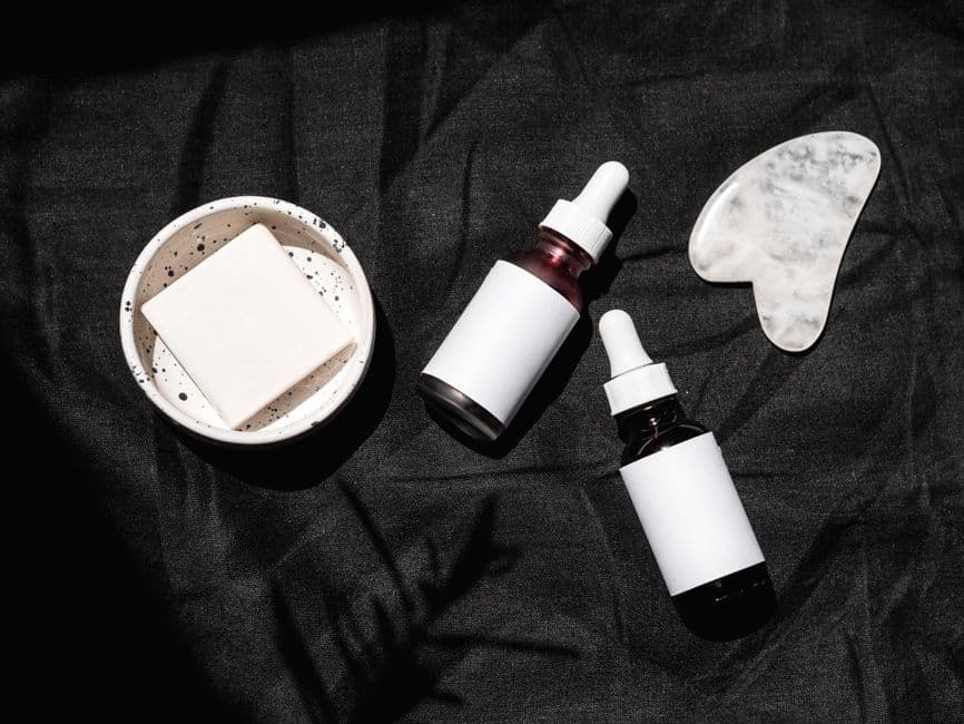 Two skincare serum bottles side by side